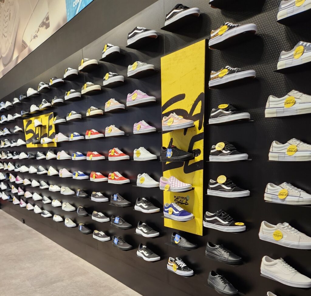 Shoes on dislay using slatwall shoe shelves in a shoe store