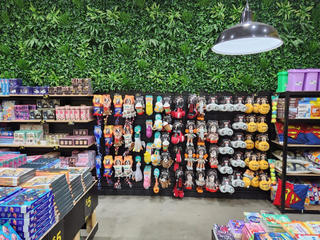 Items displayed using slatwall panels and accessories in a book store.