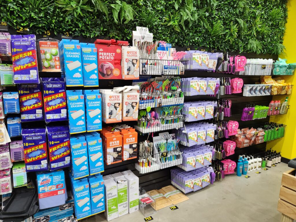 Heavy duty pegboard hooks and baskets on black slatwall panel - Hardware Store