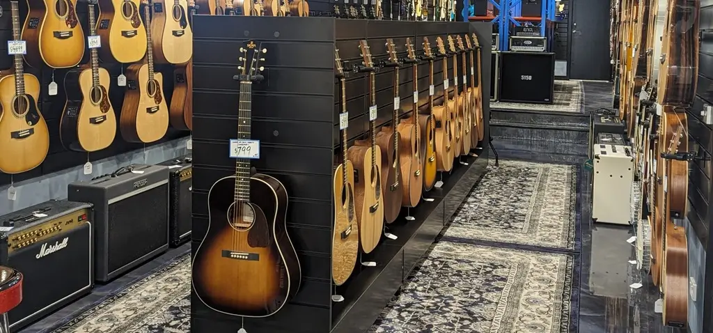 Slatwall gondola shelving in music store.