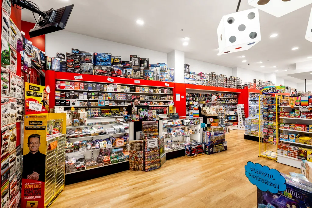 Games World Doncaster retail store featuring white plain panel gondola shelving with organised displays of board games, puzzles, toys, and collectibles in Melbourne.