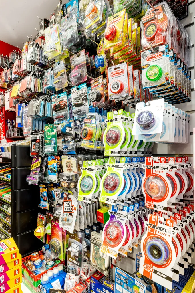 Pegboard display with hanging gaming accessories, collectibles, and specialty products at Games World Doncaster in Melbourne.