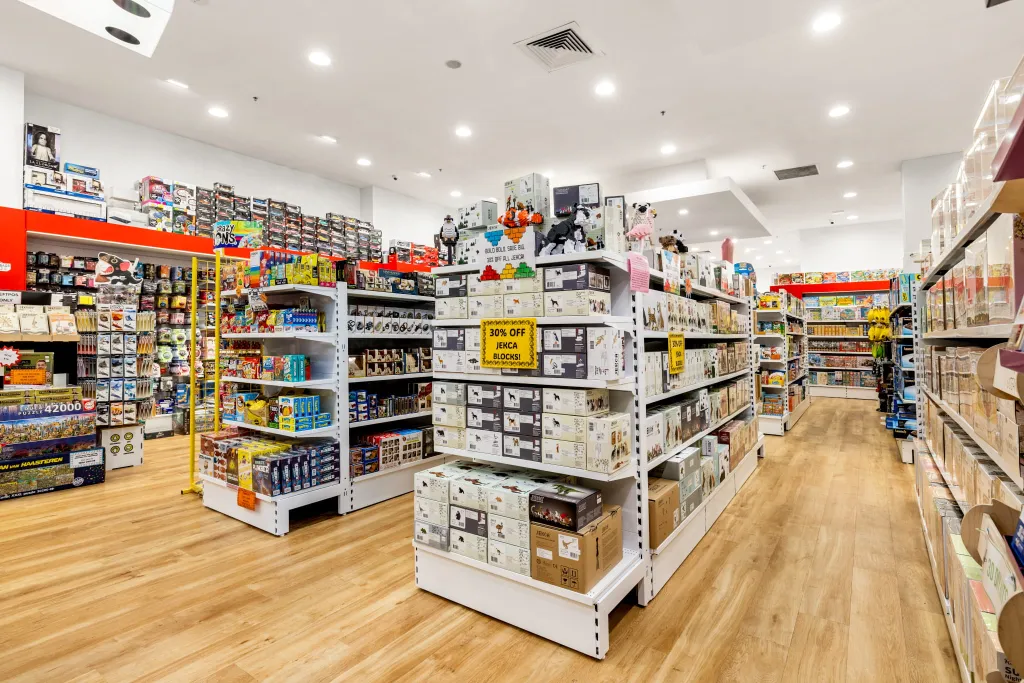 Games World Doncaster store interior featuring white gondola shelving with organised displays of board games, puzzles, toys, and collectibles in Melbourne.